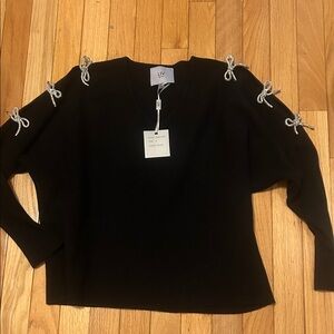 LIV Women's Black V-Neck Sweater with Silver Bow Accents